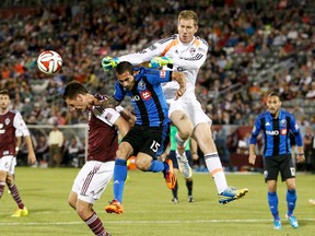 Colorado Rapids goalkeeper Clint Irwin (1) makes a save against Montreal Impact midfielder Andres Romero (15) in the second half at Dick's Sporting Goods Park. The Rapids defeated the Impact 4-1.  Isaiah J. Downing-USA TODAY Sports