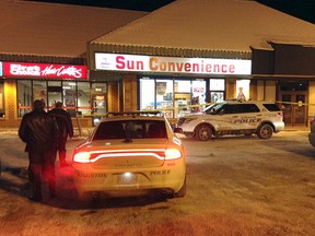Kingston Police attend the scene of a robbery at the Sun Convenience store at 900 Montreal Street which occurred around 7 p.m. on Monday January 18 2016. The lone male suspect got away with an undisclosed amount of cash. Paul Schliesmann /The Kingston Whig-Standard/Postmedia Network