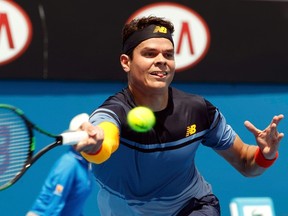 Canada's Milos Raonic stretches to hit a shot during his first round match against France's Lucas Pouille at the Australian Open tennis tournament at Melbourne Park, Australia, January 19, 2016. REUTERS/Brandon Malone