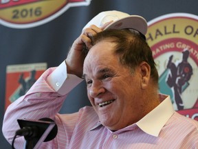 Former Cincinnati Reds player and manager Pete Rose laughs during a press conference where it was announced that he will be inducted into the Reds Hall of  Fame Tuesday, Jan. 19, 2016 in Cincinnati. (AP Photo/Gary Landers)