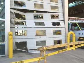 Damage to the bay doors at the Royal Alexandra Hospital after an ambulance was stolen Jan. 19, 2016. (Perry Mah/Edmonton Sun)