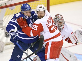 Detroit Red Wings defenceman Niklas Kronwall (55) tries to move Toronto Maple Leafs centre Leo Komarov (47) from in front of his net as goalie Petr Mrazek looks on at Air Canada Centre. (Tom Szczerbowski/USA TODAY Sports)