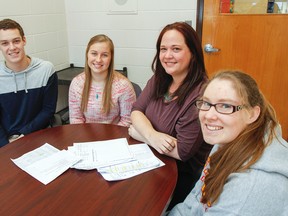 Corinna Goldring, second from right, loves her role as a guidance counsellor at Sydenham High School, especially when it comes to helping Grade 12 students figure out what their options are for their post-secondary lives. Goldring is pictured with Grade 12 students Skylar Clow, left to right, Emily Moslinger and Eryn Fletcher. (Julia McKay/The Whig-Standard)
