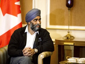 In a Sunday, Dec. 20, 2015 file photo, Harjit Sajjan, Canadian Defence Minister, is welcomed by Karim Sinjari, Interior Minister of the Kurdish Regional Government (KRG), not pictured, upon his arrival to Irbil, northern Iraq. Canada has been excluded from a meeting of defence ministers in Paris Wednesday, Jan. 20, 2016, to discuss the fight against Islamic State militants. Sajjan tried to suggest it wasn't a big deal on Tuesday, saying this isn't the only meeting. (AP Photo/Seivan M.Salim, File)