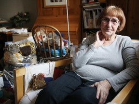 Pat Reddy, 69, sits and knits at her home in central Edmonton, AB on Tuesday, January 19, 2016. Reddy's Capital Region Housing Corp. (CRHC) subsidy is in jeopardy over her knitting sales and is facing the possibility of losing her Strathern apartment of 24 years. TREVOR ROBB/Edmonton Sun