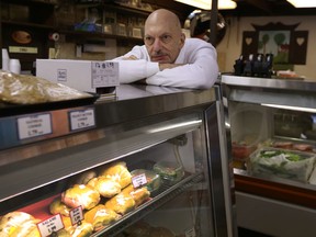 Perry Schneider poses for a photo in The German Town on Slater Street in Ottawa Tuesday Jan 19, 2016.  The German Town is closing it's doors after being in business for many years in Ottawa.