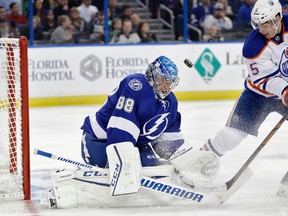 Tampa Bay Lightning goalie Andrei Vasilevskiy (88), of Russia, makes a save on a shot by Edmonton Oilers defenseman Mark Fayne (5) during the first period of an NHL hockey game Tuesday, Jan. 19, 2016, in Tampa, Fla. (AP Photo/Chris O'Meara)