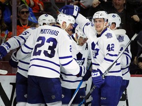 Toronto Maple Leafs defenceman Matt Hunwick is swarmed by teammates celebrating his game-winning goal against the Philadelphia Flyers in Philadelphia on Jan. 19, 2016.  (AP Photo /Tom Mihalek)