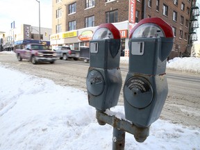 Vehicles make their way down elm street past parking meters in Sudbury, Ont. on Tuesday, January 19, 2016. .  
Gino Donato/Sudbury Star/Postmedia Network