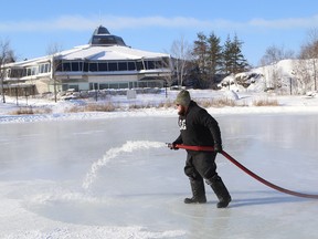 Mark Laabs, of Candu Engineering Construction Ltd., floods the ice surface for the skating path on Ramsey Lake in Sudbury, Ont. on Tuesday January 19, 2016. The skating path will have a new branch extending to the Northern Water Sports Centre where 12 rinks for the annual Pond Hockey Festival on the Rocks will be located. The festival runs from Feb. 5-7. Snow Day, a free day of family activities is also planned for Feb. 6 on the ice near Science North. John Lappa/Sudbury Star/Postmedia Network