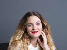 Drew Barrymore poses for a portrait to promote her new book "Wildflower," in New York. Barrymore, 40, who launched her Flower brand of affordable cosmetics exclusively at Wal-Mart in 2013, says she’s in discussions with various retailers overseas to sell her cosmetics in such countries as China, South America, Australia and United Kingdom. She’ll also be launching her own e-commerce business later this year.  (Photo by Amy Sussman/Invision/AP)