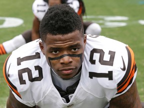 In this Dec. 21, 2014, file photo, Cleveland Browns' Josh Gordon (12) stretches before an NFL football game against the Carolina Panthers in Charlotte, N.C. Several teams will be missing key players when the NFL season kicks off this weekend.  (AP Photo/Bob Leverone, File)