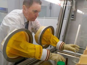 TIM MILLER/The Intelligencer
Wynand Bekker, owner of Shoppers Drug Mart on Dundas Street East, tries out their newly installed compounding aseptic isolator glove box on Tuesday, January 19, 2016 in Belleville. The equipment, which is the only one in the Quinte region, is used to prepare drip sets, injections, CADDs and numerous other sterile preparations.