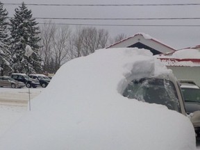 A tweeted photo by the OPP on Jan. 19, 2016 shows just how snow-covered a car was when its driver was pulled over and charged. (OPP/Twitter)