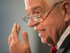 Immigration Minister John McCallum briefs journalists at the Welcome Centre in Toronto's Pearson Airport on Thursday, December 31, 2015. (THE CANADIAN PRESS/Chris Young)
