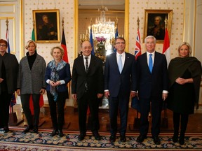 Defence ministers pose for a family photo at the Defence Ministry in Paris, France, January 20, 2016. From L-R, Australia's Defence Minister Marise Payne, Italy's Defence Minister Roberta Pinotti, German Defence Minister Ursula von der Leyen, French Defence Minister Jean-Yves Le Drian, U.S. Defense Secretary Ash Carter, Britain's Defence Secretary Michael Fallon and Netherlands Defence Minister Jeanine Hennis-Plasschaert. (REUTERS/Jacky Naegelen)