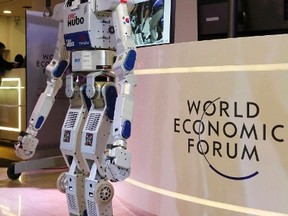 HUBO, a multifunctional walking humanoid robot performs a demonstration of its capacities next to its developer Oh Jun-Ho, Professor at the Korea Advanced Institute of Science and Technology (KAIST) during the annual meeting of the World Economic Forum (WEF) in Davos, Switzerland January 20, 2016.