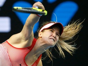 Eugenie Bouchard serves to Agnieszka Radwanska during their second-round match at the Australian Open in Melbourne Wednesday, Jan. 20, 2016. (THE CANADIAN PRESS/AP/Vincent Thian)