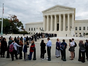 Visitors wait in line to watch arguments in the "Wichita Massacre" case at the U.S. Supreme Court building in Washington, October 13, 2015. (REUTERS/Jonathan Ernst)