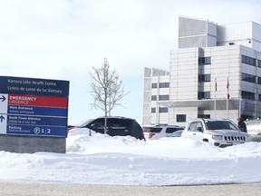 A sign points to the parking lot at Health Sciences North in Sudbury on Monday January 18, 2016. (Gino Donato/Postmedia Network)