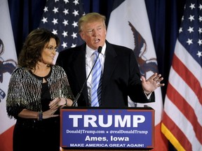 U.S. Republican presidential nominee hopeful Donald Trump (R) thanks the crowd after receiving former Alaska Gov. Sarah Palin's endorsement at a rally at Iowa State University in Ames, Iowa January 19, 2016. (REUTERS/Mark Kauzlarich)