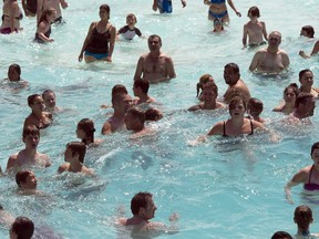 Bathers bob in the wave pool to beat the 30C heat at the Super Aqua club, Tuesday, July 28, 2015 in Pointe-Calumet, Que. Canada as a whole had its 19th consecutive year of warmer-than-average temperatures in 2015, but was nowhere near global record-shattering levels. THE CANADIAN PRESS/Ryan Remiorz
