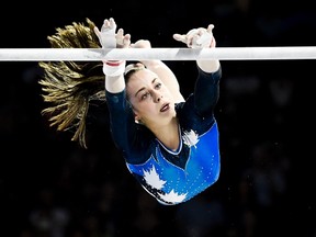 Isabela Onyshko, of Canada, competes in uneven bar at the women's artistic gymnastics competition during the Pan American Games in Toronto on Tuesday, July 14, 2015. THE CANADIAN PRESS/Nathan Denette