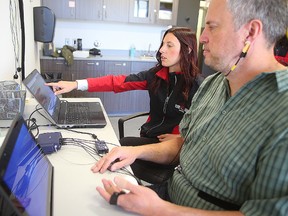 Laura Ceccarelli gives a stress test to Sun sports editor Ted Wyman at the Canadian Sports Centre.