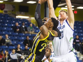 London Lightning guard Tyshawn Patterson drives past Niagara River Lions? Russ Conley during their NBL of Canada game Wednesday night in St. Catharines. (Bob Tymczyszyn/St.Catharines Standard)