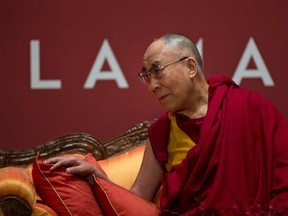 Exile Tibetan spiritual leader the Dalai Lama listens a to speaker at an event organized by his well-wishers in New Delhi, India, Monday, Jan. 4, 2016. People from different walks of life wished health and long life to the Dalai Lama who turned 80 last July. (AP Photo /Tsering Topgyal)