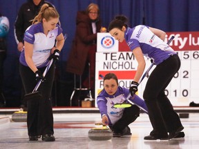 Kelsey Rocque, right, throws her rock at the Alberta Scotties Tournament of Hearts at the North Hill Community Curling Club in Calgary on Wednesday. (Aryn Toombs, Postmedia Network)
