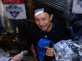 Toronto Blue Jays second baseman Munenori Kawasaki talks with the media in the club house at the end of game five against the Texas Rangers in the ALDS at Rogers Centre. (Nick Turchiaro-USA TODAY Sports)