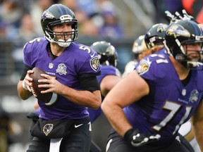 This Nov. 22, 2015, file photo shows Baltimore Ravens quarterback Joe Flacco (5) looking for a receiver in the second half of an NFL football game against the St. Louis Rams in Baltimore. (AP Photo/Nick Wass, File)