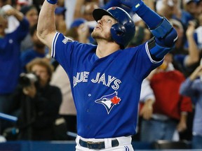 Toronto Blue Jays third baseman Josh Donaldson hits a two run homer against the Kansas City Royals during game three of the American League Championship Series in Toronto, Ont. on Monday October 19, 2015. Stan Behal/Postmedia Network