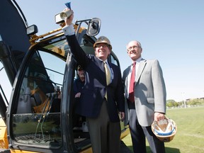 David Asper and Bill Watchorn, sound the horn to signify the official start of the construction of the new stadium at the University of Manitoba Thursday, May 20, 2010.