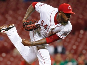This Sept. 30, 2015 file photo shows Cincinnati Reds relief pitcher Aroldis Chapman throwing in the ninth inning of a baseball game against the Chicago Cubs in Cincinnati. Florida prosecutors have decided not to file charges in a domestic disturbance case involving New York Yankees pitcher Aroldis Chapman and his girlfriend. THE CANADIAN PRESS/AP/John Minchillo, file