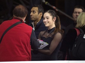 Kaetlyn Osmond signs an autograph for fans following a practice session at the Canadian Figure Skating Championships in Halifax on Thursday, January 21, 2016. THE CANADIAN PRESS/Darren Calabrese