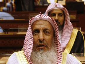 In this Tuesday, March 24, 2009 file photo, Sheikh Abdul Aziz al-Sheikh, the Saudi grand mufti listens to a speech of King Abdullah of Saudi Arabia at the Consultative Council in Riyadh, Saudi Arabia. Saudi Arabia’s top cleric says playing chess is forbidden in Islam, describing it as a waste of time saying it leads to rivalry and enmity. His comments, made to a Saudi religious channel and uploaded to YouTube in December 2015, sparked backlash and heated discussion on Twitter in recent days among Arabic users. (AP Photo/Hassan Ammar, File)