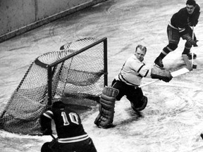 Toronto Maple Leafs goalie Turk Broda saved a shot made by Ranger Tony Leswick faces the Rangers at New York's Madison Square Garden on Jan. 12, 1950. (THE CANADIAN PRESS/AP)