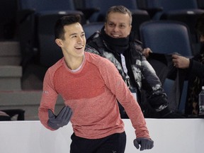 Patrick Chan laughs with his coaches during a practice session at the Canadian Figure Skating Championships in Halifax on Thursday, January 21, 2016. THE CANADIAN PRESS/Darren Calabrese