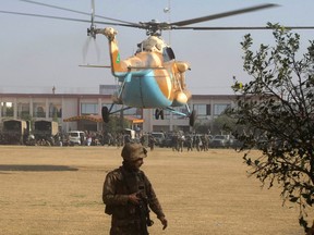 A Pakistani army helicopter lands in Bacha Khan University in Charsadda town, some 35 kilometers (21 miles) outside the city of Peshawar, Pakistan, Wednesday, Jan. 20, 2016. Gunmen stormed Bacha Khan University named after the founder of an anti-Taliban political party in the country's northwest Wednesday, killing many people, officials said. (AP Photo/Mohammad Sajjad)