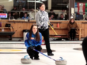 North Bay skip Laura Payne, back, and her team almost caused an early-tournament upset at the 2016 Northern Ontario Scotties Tournament of Hearts, but defending champion skip Tracy Fleury, front, of Sudbury scored three on her final rock to take a 10-9 win in Draw 2 at the McIntyre Curling Club on Thursday. BENJAMIN AUBÉ/The Daily Press