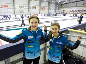 Mackenzie Zacharias (left, 16) and her sister, Emily (14), are members of the youngest curling team at the Scotties.