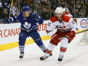 Maple Leafs defenceman Morgan Rielly (44) keeps his eye on Carolina Hurricanes forward Eric Staal during the first period at the Air Canada Centre on Thursday. (John E. Sokolowski-USA TODAY Sports)