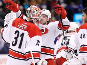 Hurricanes goaltender Eddie Lack is congratulated following his 32-save shutout over the Maple Leafs on Thursday night at the ACC. (USA TODAY SPORTS/PHOTO)