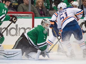 Stars goalie Antii Niemi stops Oilers forward Anton Lander during Thursday's game in Dallas. (USA TODAY SPORTS)