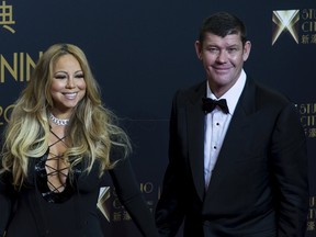 Singer Mariah Carey (L) and Australian billionaire James Packer, co-chairman of Melco Crown Entertainment, pose on the red carpet before the opening ceremony of Studio City and the premiere of the short film "The Audition" in Macau, China, October 27, 2015. REUTERS/Tyrone Siu
