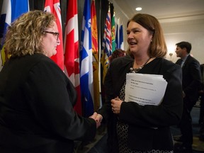 Alberta Health Minister Sarah Hoffman, left, and Federal Minister of Health Jane Philpott talk after a news conference following the final day of a meeting of provincial and territorial health ministers in Vancouver, B.C., on Thursday January 21, 2016. THE CANADIAN PRESS/Darryl Dyck