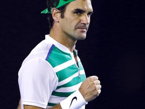 Roger Federer of Switzerland celebrates after defeating Grigor Dimitrov of Bulgaria in their third round match at the Australian Open tennis championships in Melbourne, Australia, Friday, Jan. 22, 2016.(AP Photo/Aaron Favila)