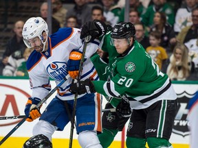 Teddy Purcell and Stars centre Cody Eakin battle for the puck during Thursday's game in Dallas. (USA TODAY SPORTS)